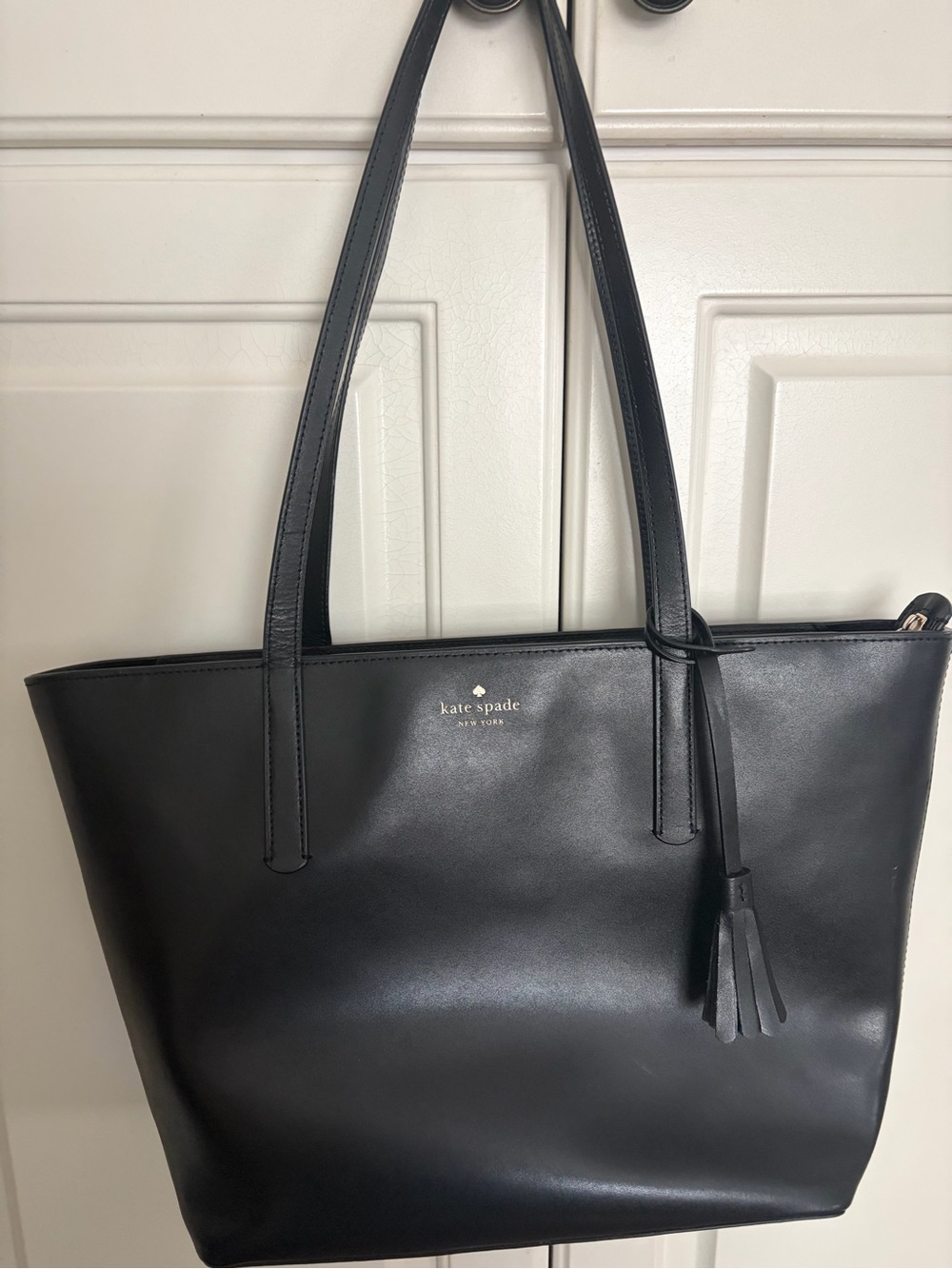 kate spade black leather tote with tassel